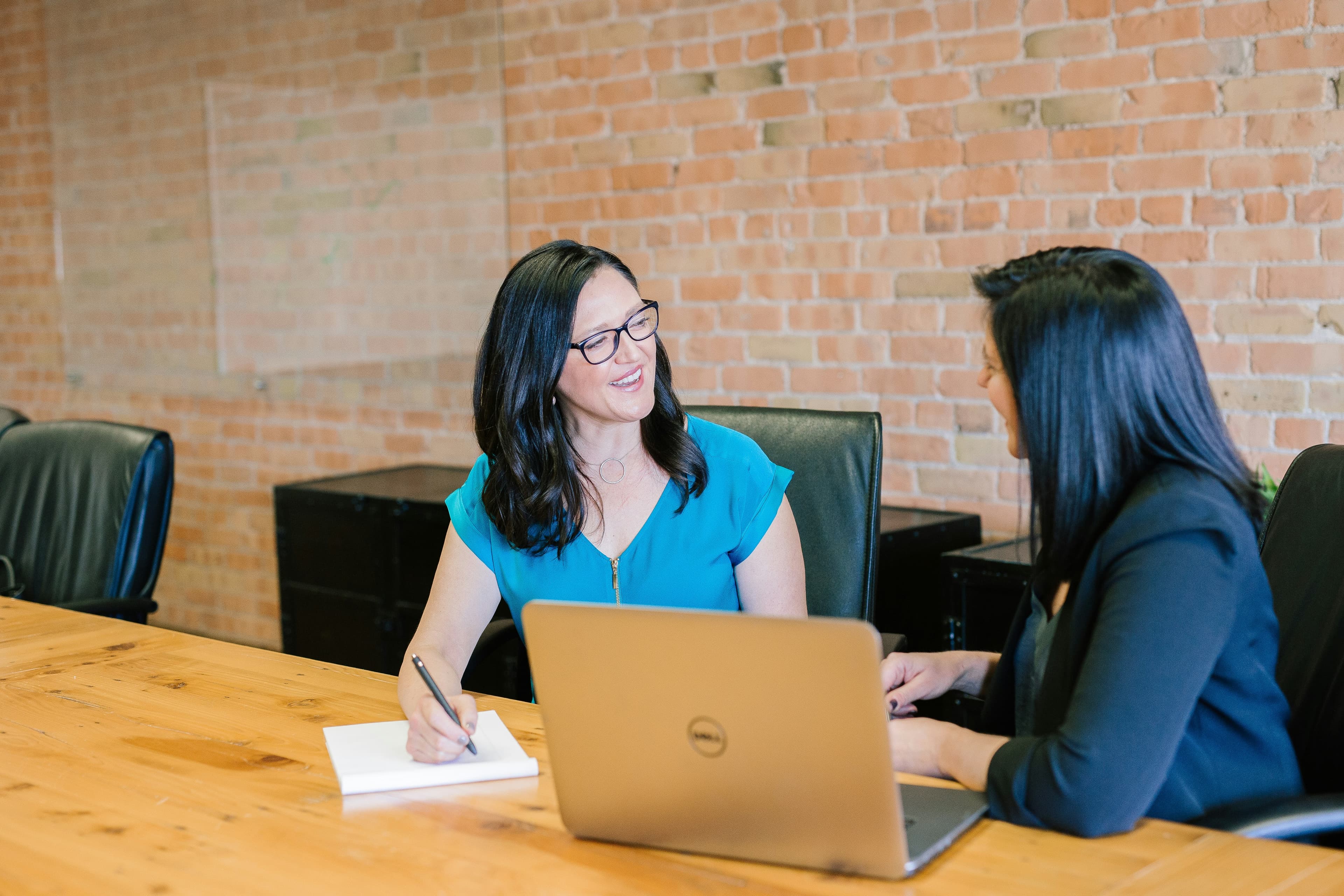 Recruiter browsing member directory on a laptop